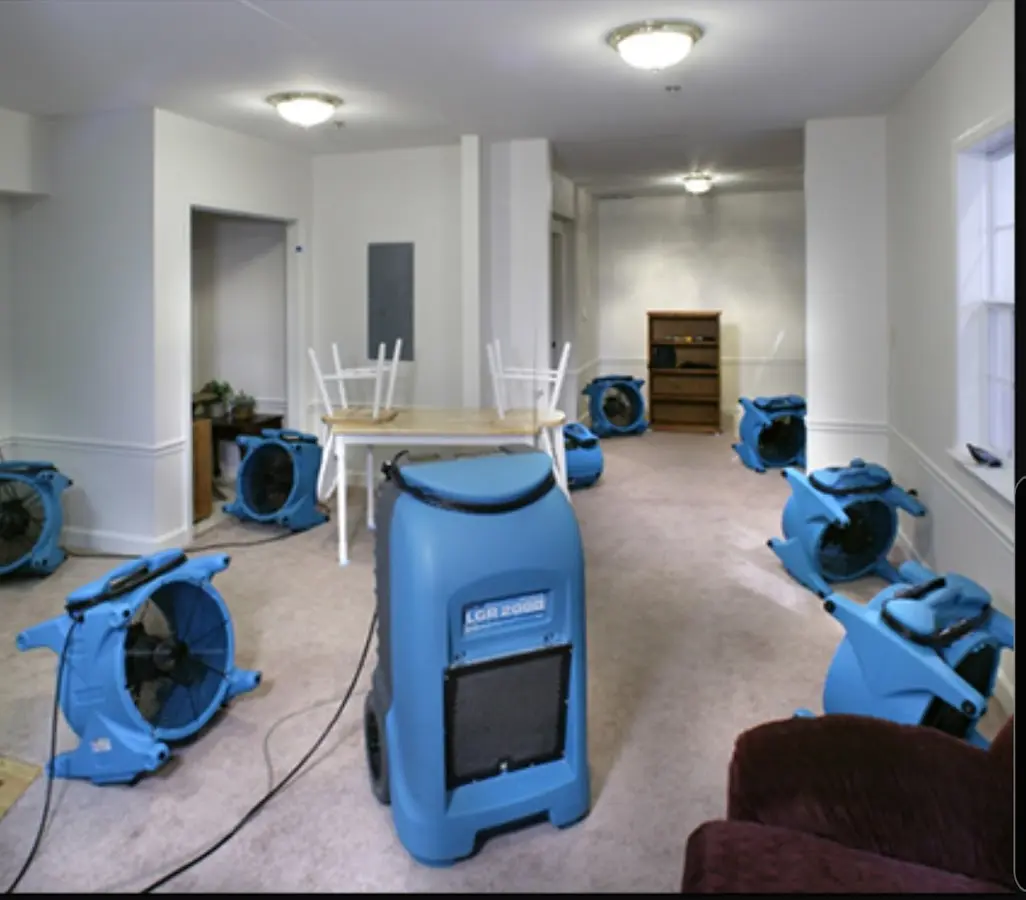 Air movers and dehumidifier setup for Water Damage Restoration in Martin